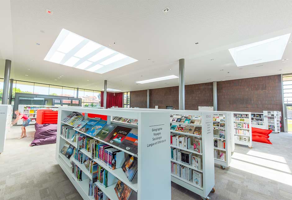 Interior view of the light contribution by Ridgelight and Longlight skylights, Lezoux Media Library, France 
