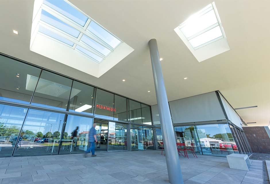 Combination of two VELUX Ridgelight and VELUX Longlight skylight solutions at the Lezoux Media Library, France  