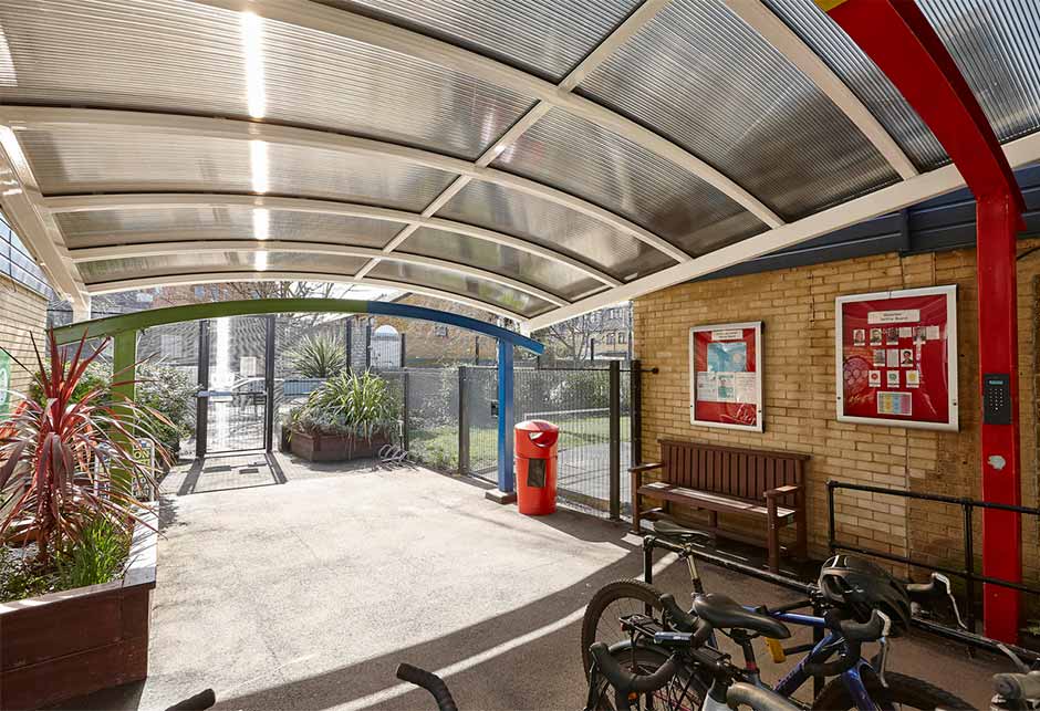 Polycarbonate Continuous Rooflight canopy creates sheltered reception area